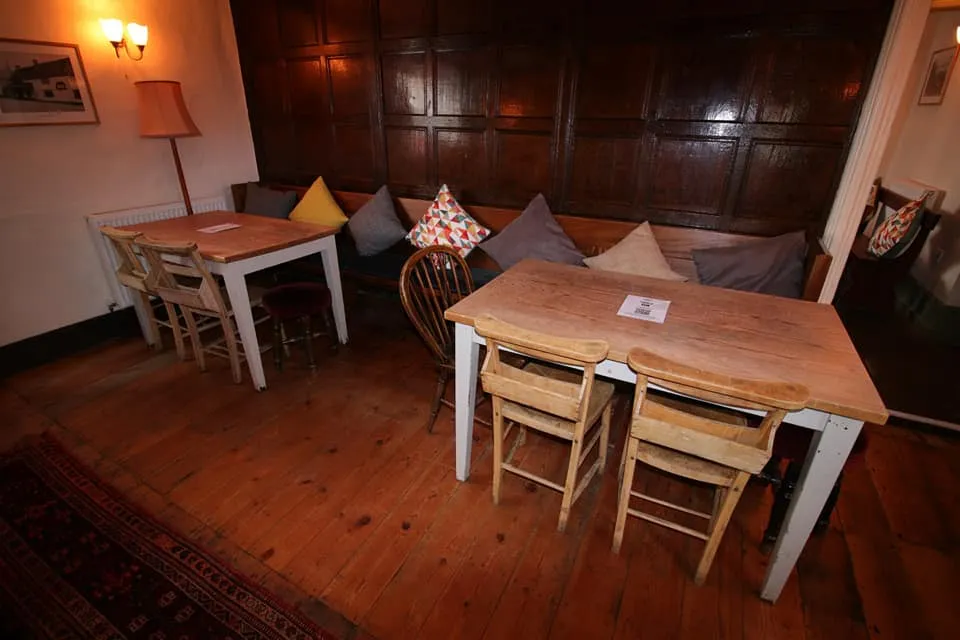 A cosy panelled seating corner at The Butcher’s Hook